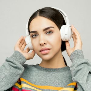 Person sitting in a calm, focused pose with eyes closed.
