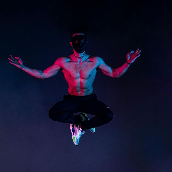 Woman in a dynamic yoga flow pose, captured mid-motion.
